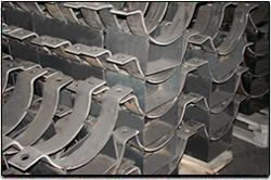 Невский завод ТРУБОДЕТАЛЬ поставил опоры корпусные подвижные хомутовые из стали марки 09Г2С для нефтеперерабатывающего предприятия .